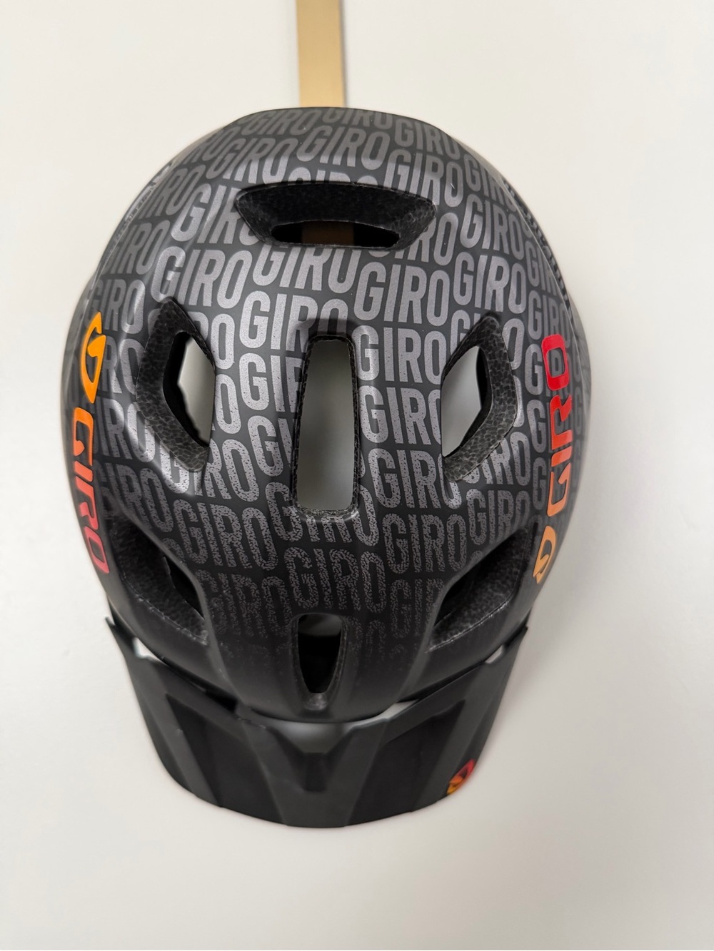 Giro Black Helmet with Orange and Red Logo Accents